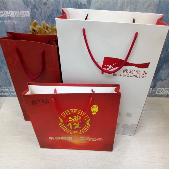 单铜纸白牛皮手挽手提袋logo设计制作广告宣传白卡礼品纸袋手拎袋